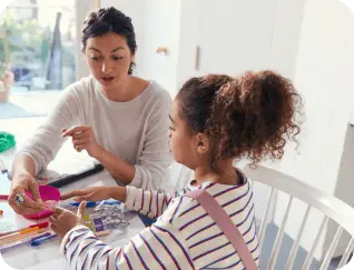 Caregiver painting with child